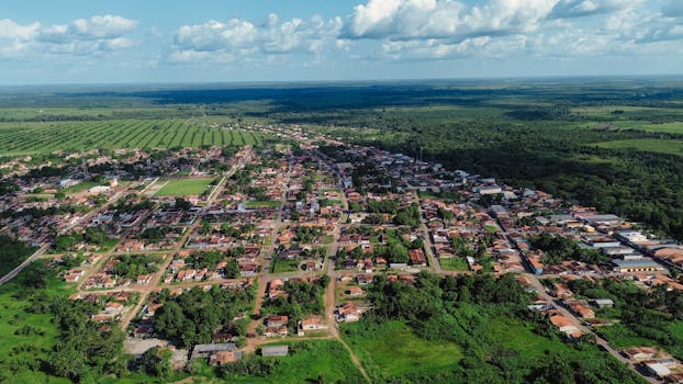 Aerial view of Garrafão do Norte town and surrounding lush fields in Brazil.